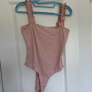 Pink body suit never worn without tags